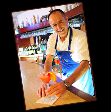 Eli Munoz serves a drink at M&M's Italian Restaurant and Lounge in Los Banos - Photo by Charles Guest of MemorablePlaces.com © Copyright 2012